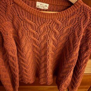 rust-colored knit sweater